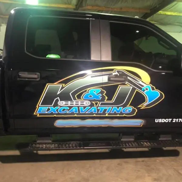 K & J Excavating Custom Door Logo